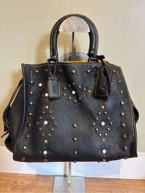 2015 Coach Rogue 25 “Western Stud”